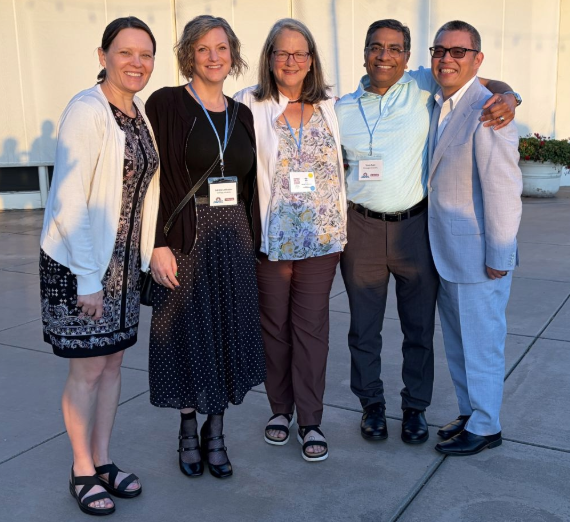 SBA faculty standing outside the CJBE conference