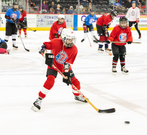Students participate in a hockey game