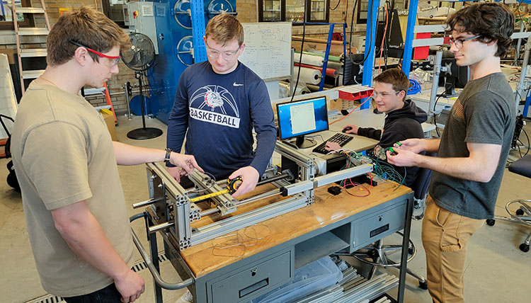 mechanical and electrical engineers work on machine mechanical and electrical engineers work on machine