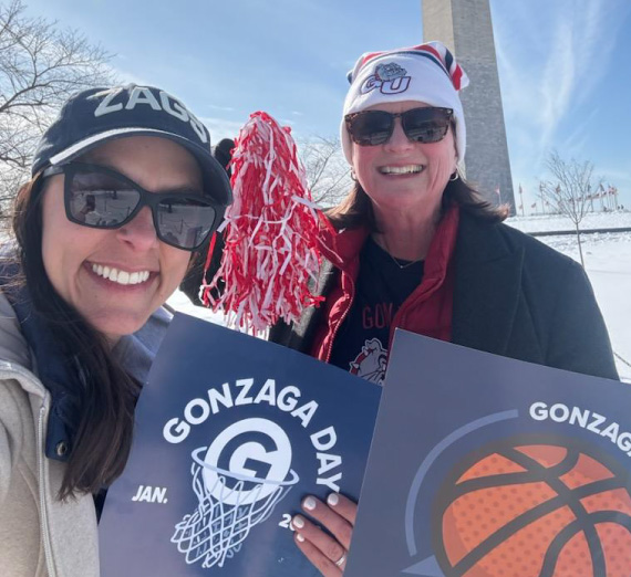 Spirited Gonzaga University employees pose with Gonzaga Day cheer cards in front of the Washington Monument in D.C. Spirited Gonzaga University employees pose with Gonzaga Day cheer cards in front of the Washington Monument in D.C.