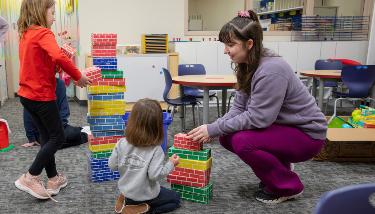 BCBA student works with child in clinical experience BCBA student works with child in clinical experience