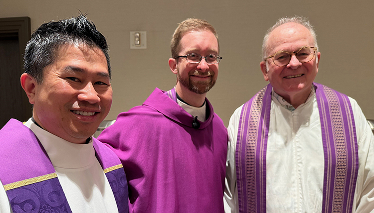 Three priests stand together purple robes. Three priests stand together purple robes.