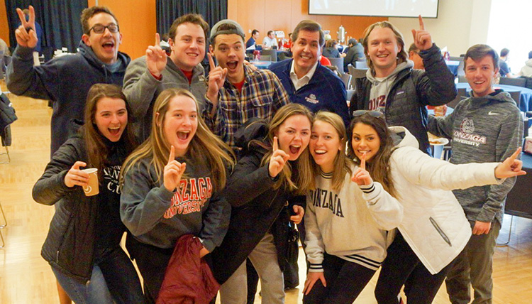 Gonzaga President Thayne M. McCulloh poses for a picture with students. Gonzaga President Thayne M. McCulloh poses for a picture with students.