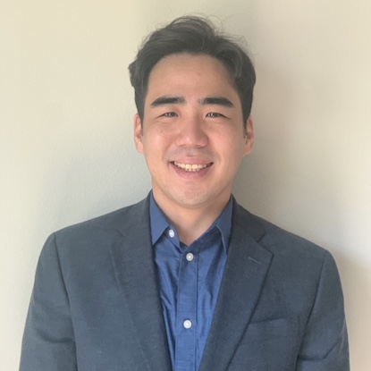 Andrew Kim looks at camera and smiles. 