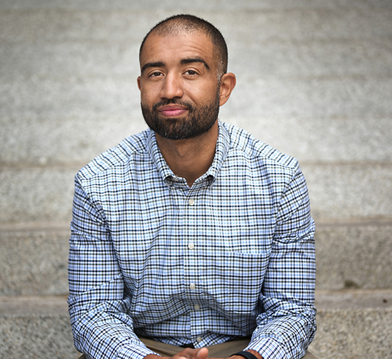 A man sitting on concrete steps