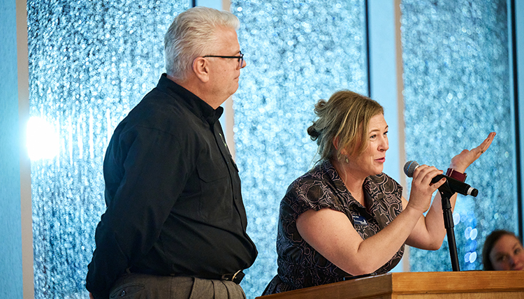 Molly Ayers (right), the assistant dean of the Center for Community Engagement, addressing the crowd at the 30th Anniversary Celebration. Molly Ayers (right), the assistant dean of the Center for Community Engagement, addressing the crowd at the 30th Anniversary Celebration.