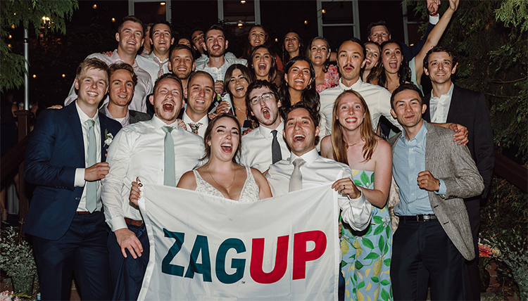 wedding party holding flag reading zag up wedding party holding flag reading zag up