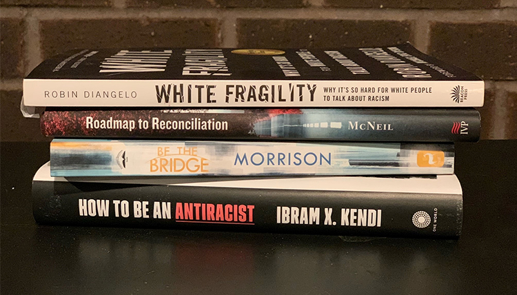 a stack of books about racism and white fragility a stack of books about racism and white fragility