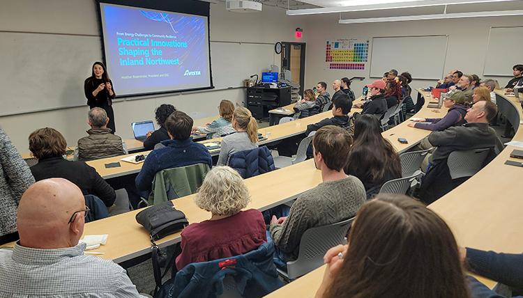A crowded room at a discussion. A crowded room at a discussion.