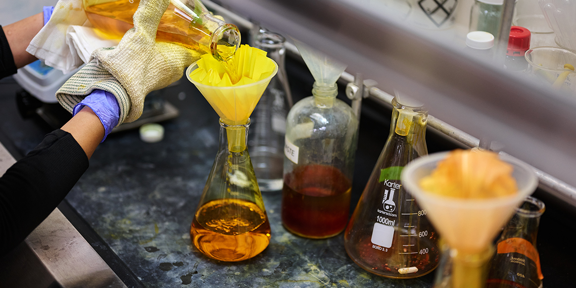Beakers on a counter in a lab.