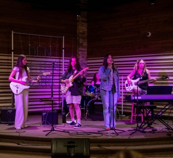 A group of students playing in a band in the Hemmingson Den for the Wednesdays' 