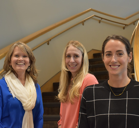 Innovation Staff recipient award winners, 2024, smiling in stairwell. 