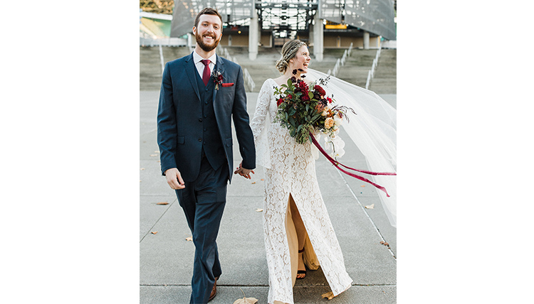 bride and groom exiting building bride and groom exiting building