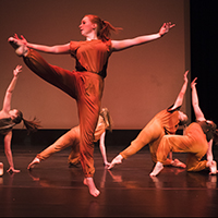 Dancers performing on the Magnuson Theatre stage. Dancers performing on the Magnuson Theatre stage.