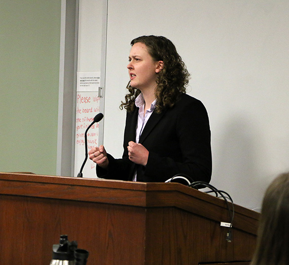 Sharon Maher stands in front of a mock trial court room. Sharon Maher stands in front of a mock trial court room.