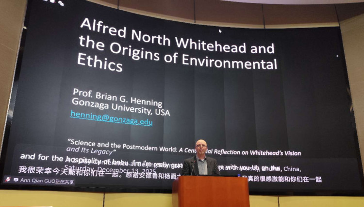 Conference presentation in Zhuhai, China featuring a large screen displaying the title ‘Alfred North Whitehead and the Origins of Environmental Ethics’ by a Gonzaga University philosophy professor. The slide includes contact information and references to the event ‘Science and the Postmodern World: A Centennial Reflection on Whitehead’s Vision and Its Legacy,’ held December 2025. Conference presentation in Zhuhai, China featuring a large screen displaying the title ‘Alfred North Whitehead and the Origins of Environmental Ethics’ by a Gonzaga University philosophy professor. The slide includes contact information and references to the event ‘Science and the Postmodern World: A Centennial Reflection on Whitehead’s Vision and Its Legacy,’ held December 2025.