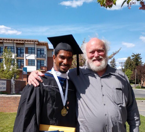 graduate student with Jesuit priest