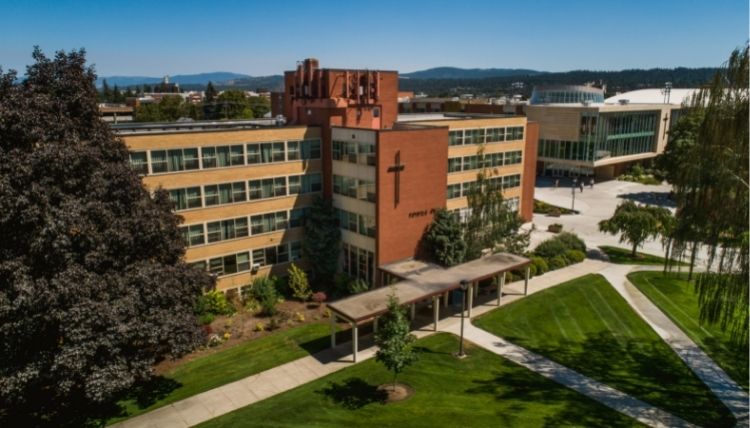 A drone shot of the front of Welch Hall, with the quad between Welch and Desmet Hall shown. A drone shot of the front of Welch Hall, with the quad between Welch and Desmet Hall shown.