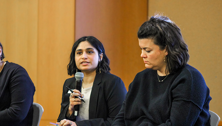 People speaking at an event. People speaking at an event.