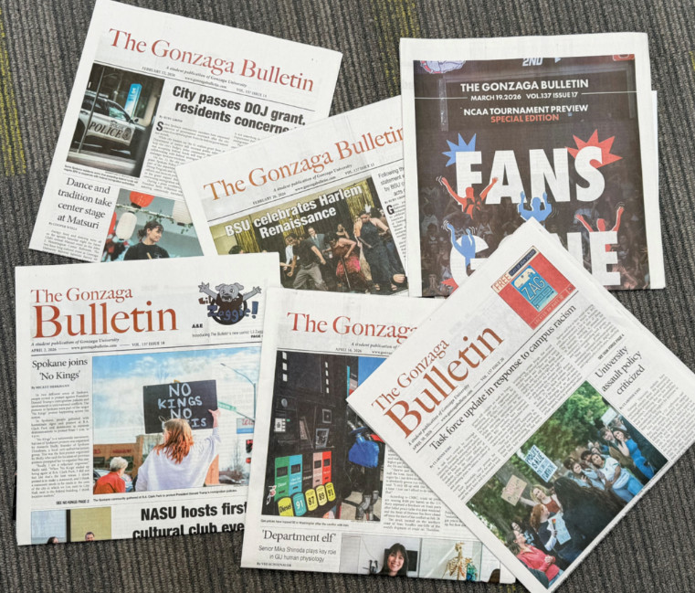 A selection of Gonzaga Bulletin newspapers arranged to view the covers.