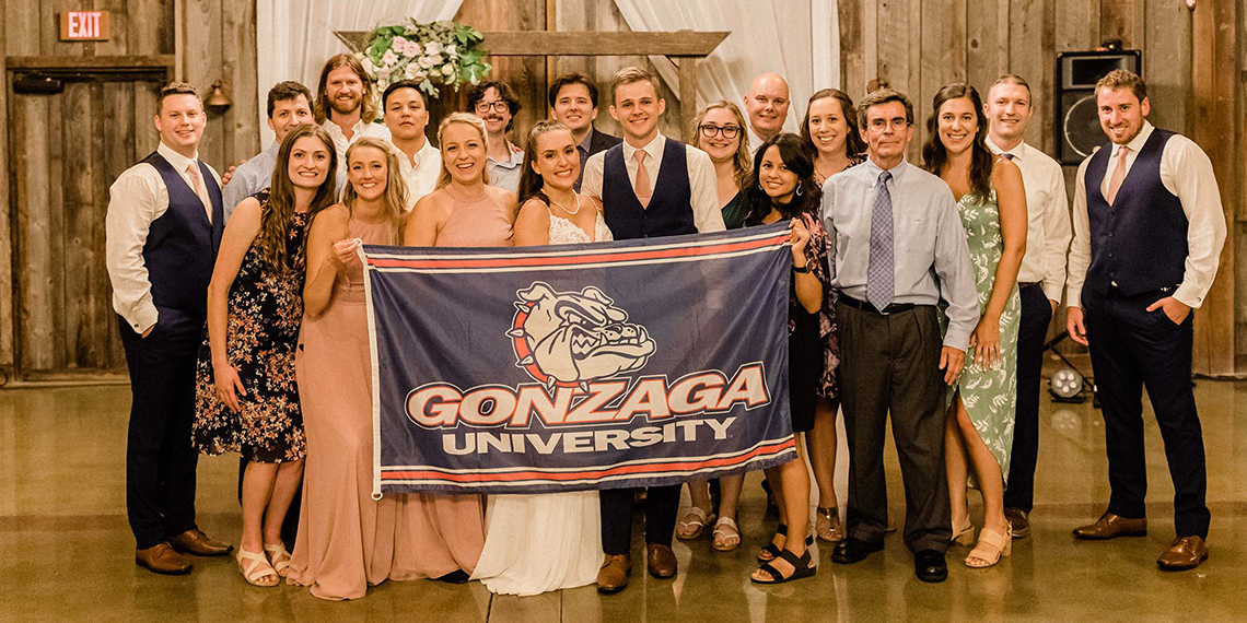 large wedding party with gu flag