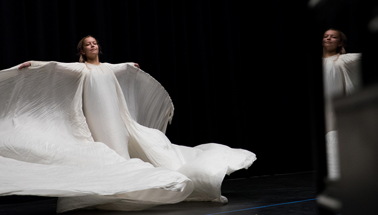 female dancer in historic flowing dance gown female dancer in historic flowing dance gown