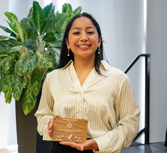Mikaela Dominique Chua Daza smiling and holding the University Ignatian Award at Gonzaga University Magis Awards. Mikaela Dominique Chua Daza smiling and holding the University Ignatian Award at Gonzaga University Magis Awards.