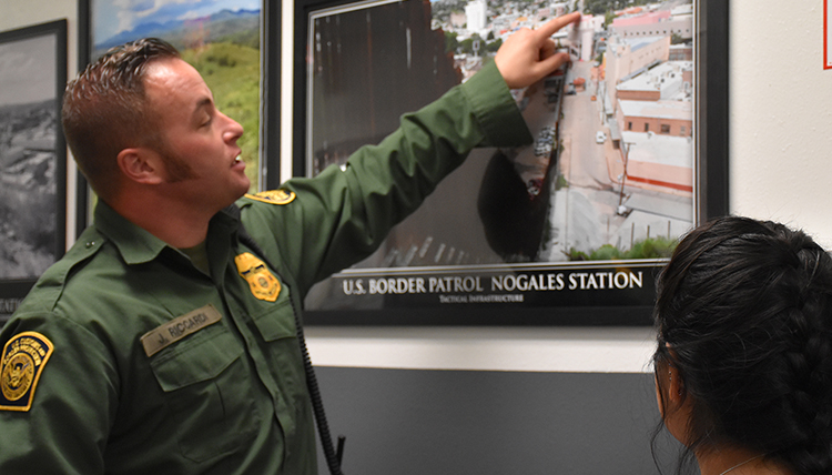 A Border Patrol Agent at the Nogales AZ port of entry visits with Gonzaga students A Border Patrol Agent at the Nogales AZ port of entry visits with Gonzaga students