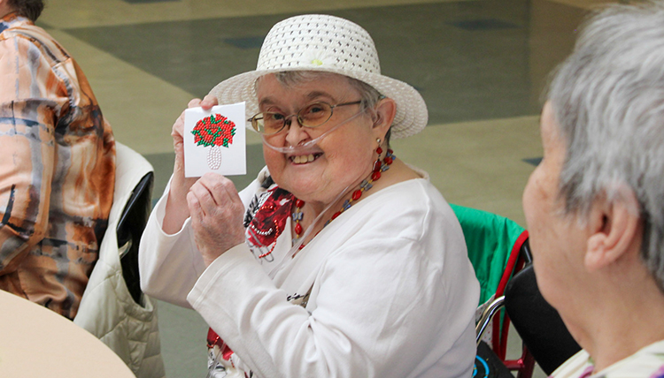 Woman holding up a craft. Woman holding up a craft.