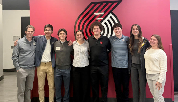 GSCG - Blazers GSCG in front of the Portland Trail Blazers logo