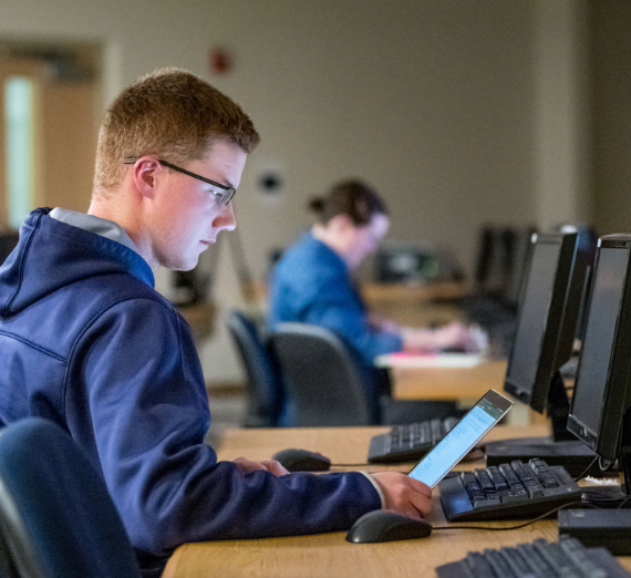 Student at a computer in a classroom