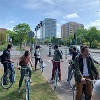 A group of students on bikes waiting for others to catch up. A group of students on bikes waiting for others to catch up.