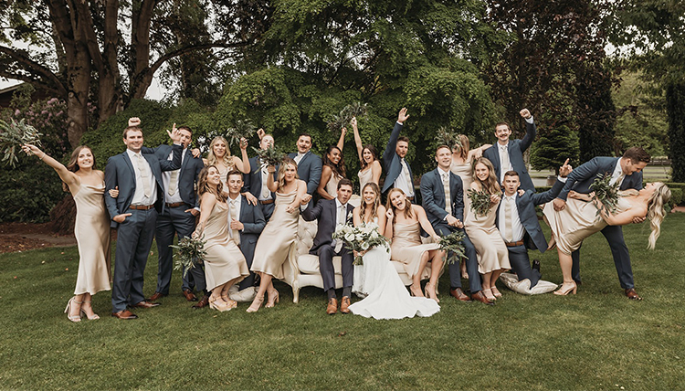 large wedding party in fun poses outdoors large wedding party in fun poses outdoors