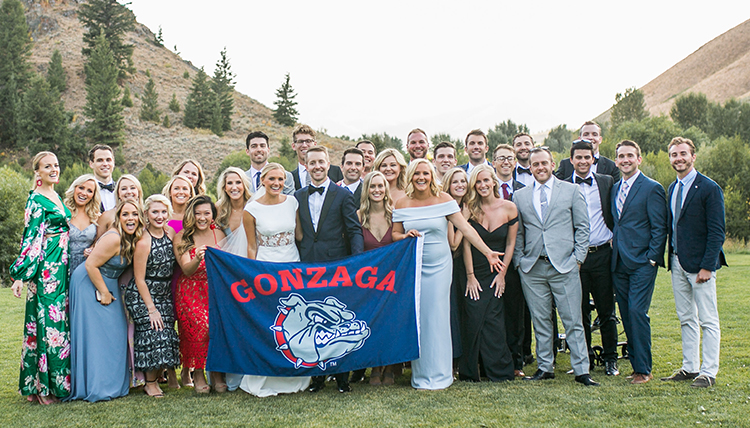 large wedding party outdoors with GU flag large wedding party outdoors with GU flag