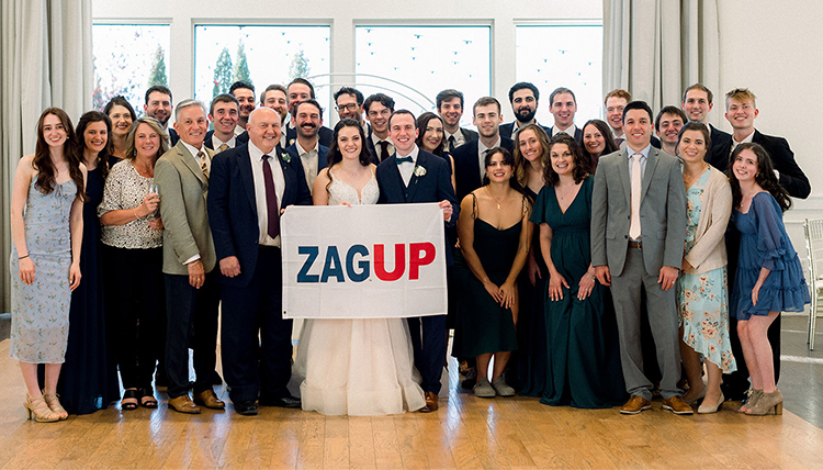 large group with gonzaga flag