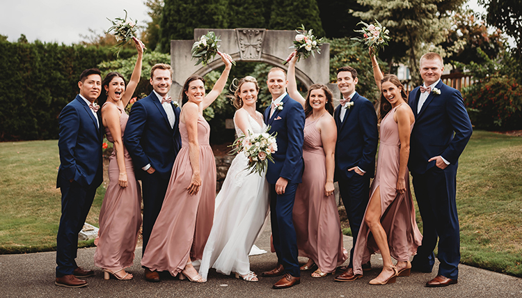 large wedding party in blue and rose