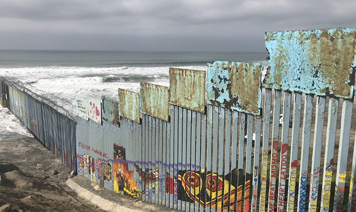 The Us-Mexico border wall extends into the Pacific Ocean. The Us-Mexico border wall extends into the Pacific Ocean.