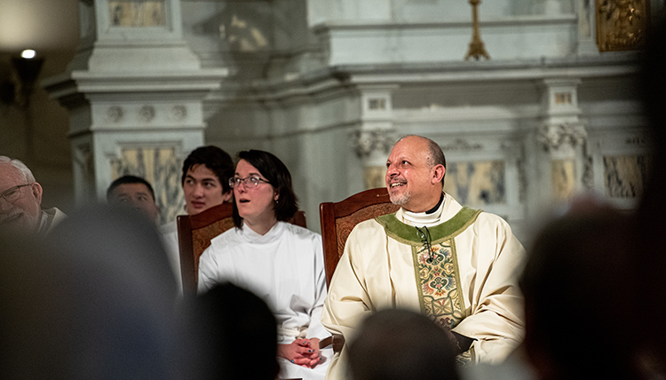Jesuits in attendance celebrate a joyful moment. Jesuits in attendance celebrate a joyful moment.