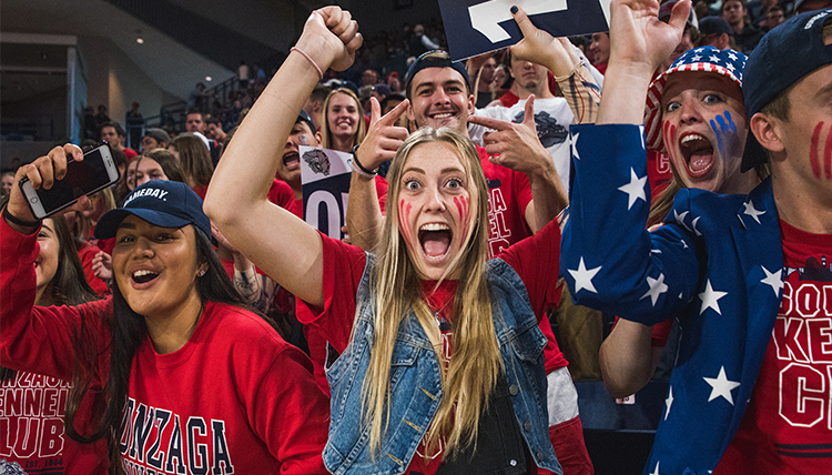 students are dressed up and painted up in The Kennel to cheer on the Zags students are dressed up and painted up in The Kennel to cheer on the Zags