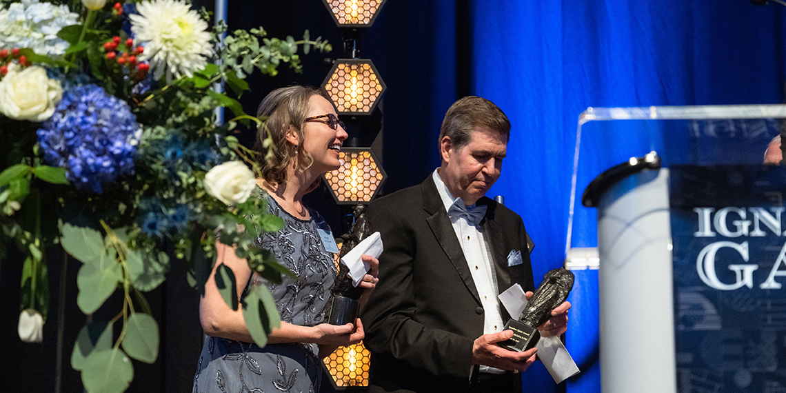 man and woman at elegant podium