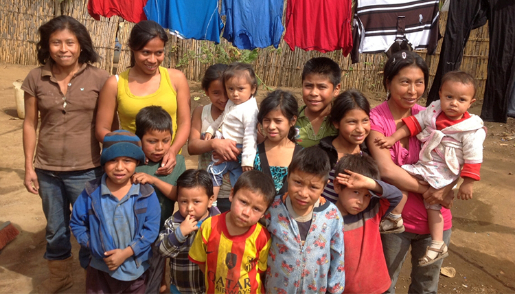 Guatemalan women and children gather for a photo Guatemalan women and children gather for a photo
