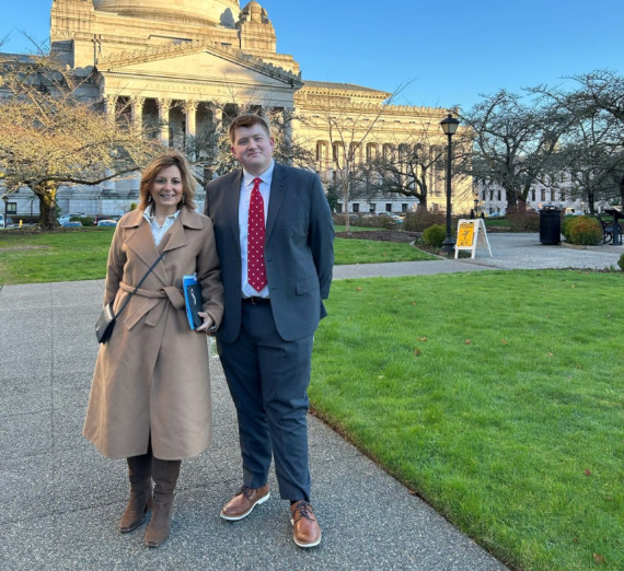 President Katia Passerini and student Jack Korshak of Gonzaga University standing in front of the Washington State capitol building in Olympia, Washington. President Katia Passerini and student Jack Korshak of Gonzaga University standing in front of the Washington State capitol building in Olympia, Washington.