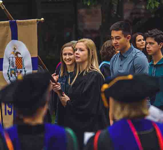 Members of the Class of 2021 take part in the 