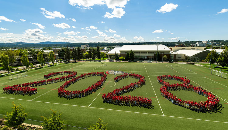 Students spell out 2028 on a field Students spell out 2028 on a field